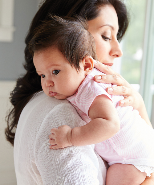 mom holding baby